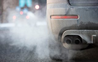 car exhaust blowing white smoke