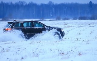 car driving on snowy road